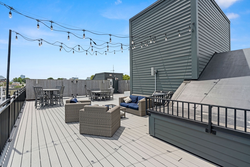 30 Polk Street, Unit 208 Boston, MA 02129 - Photo 21 of 30 a view of a balcony with chairs