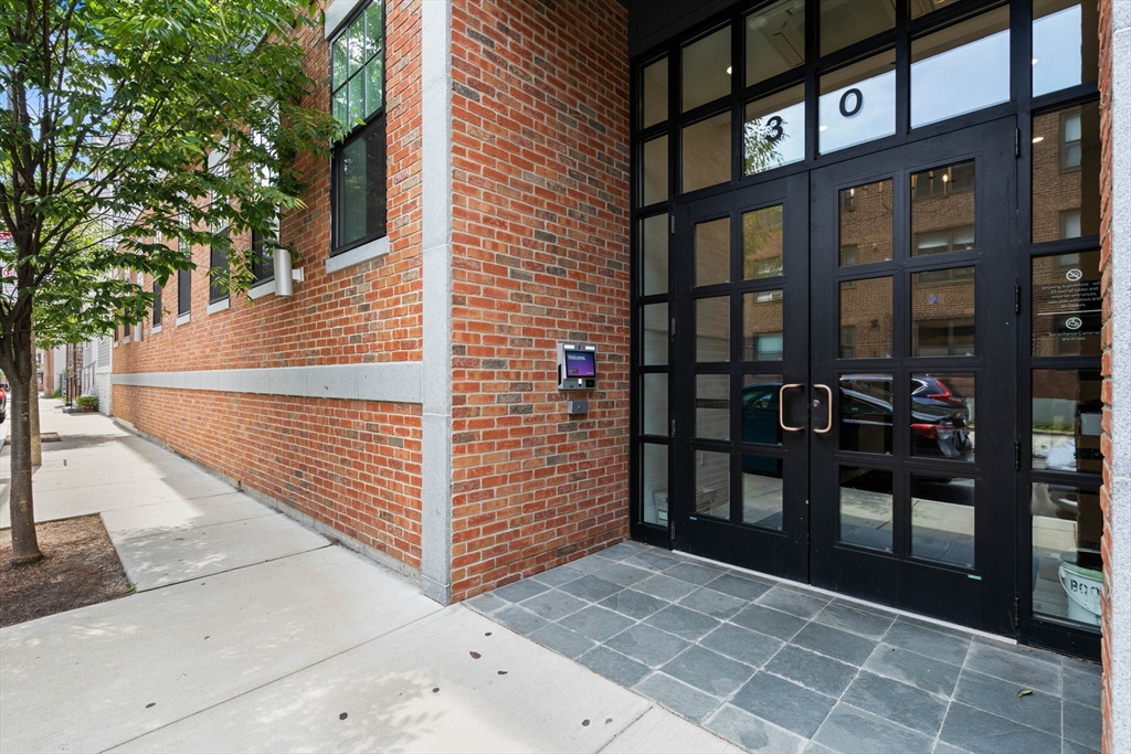 30 Polk Street, Unit 208 Boston, MA 02129 - Photo 27 of 30 a view of a brick house with a door