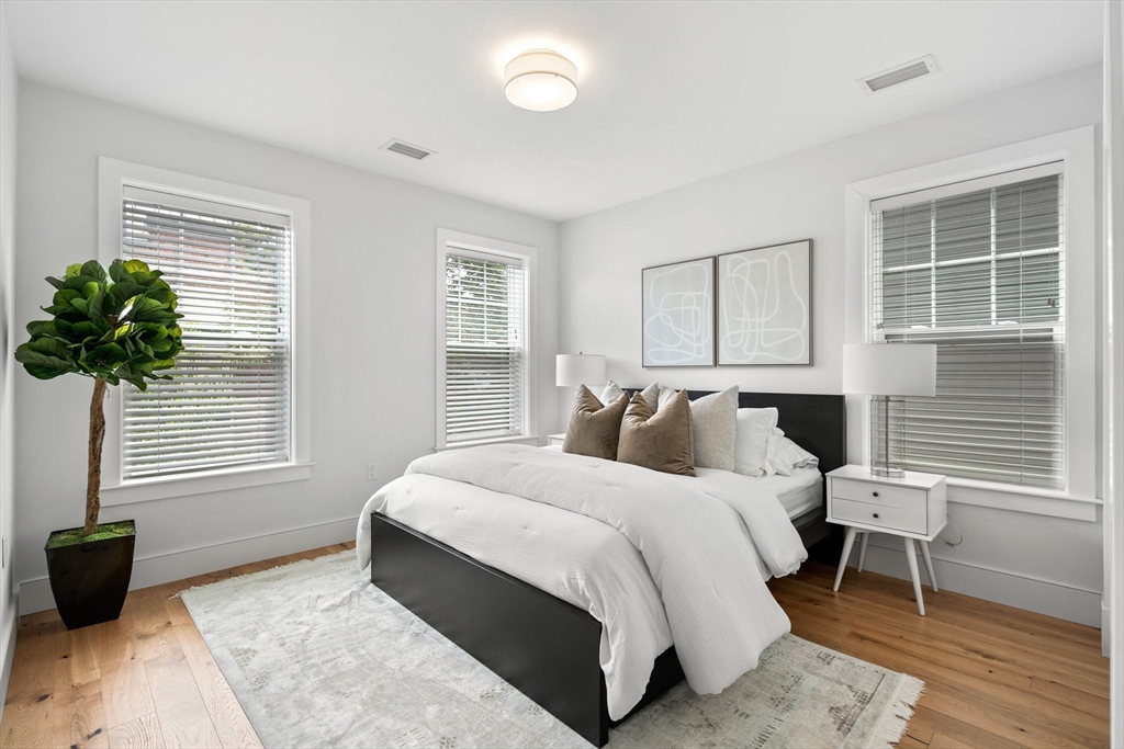 30 Polk Street, Unit 208 Boston, MA 02129 - Photo 9 of 30 a bedroom with a bed and a window