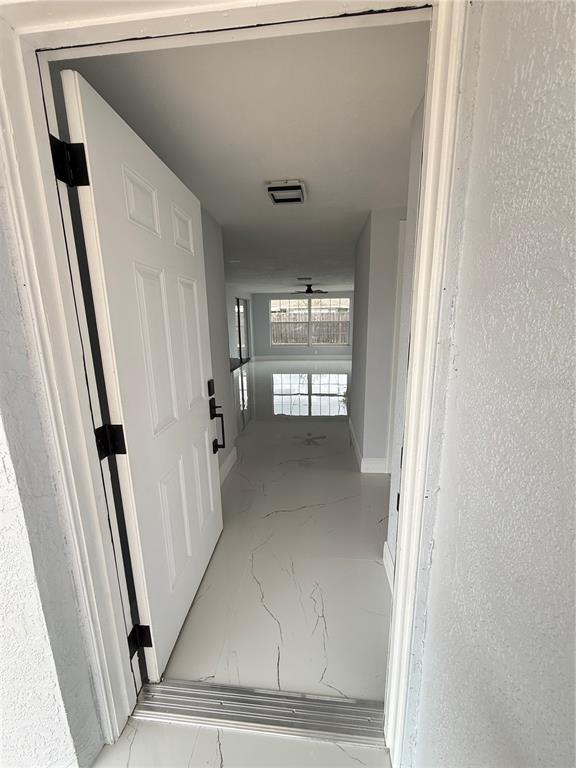 10433 Laburnum Drive Port Richey, FL 34668 - Photo 5 of 26 a view of entryway with a hallway