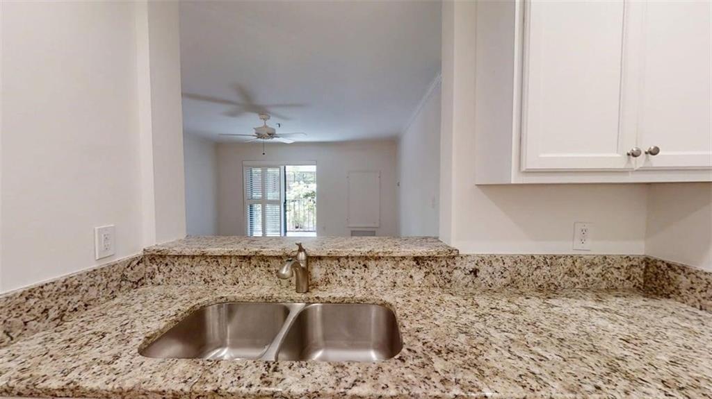 300 Johnson Ferry Road, Unit A112 Atlanta, GA 30328 - Photo 11 of 42 a bathroom with a sink and cabinets