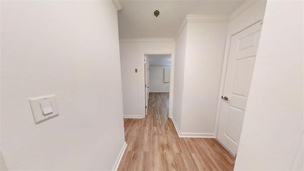 300 Johnson Ferry Road, Unit A112 Atlanta, GA 30328 - Photo 13 of 42 a view of a room with wooden floor