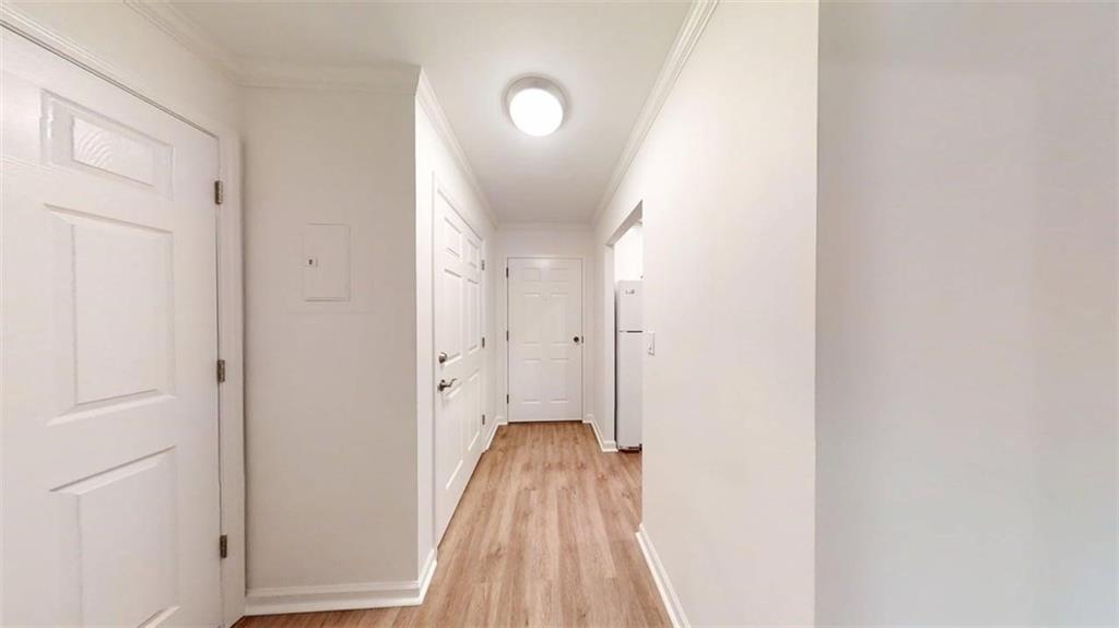 300 Johnson Ferry Road, Unit A112 Atlanta, GA 30328 - Photo 15 of 42 a view of a hallway with wooden floor