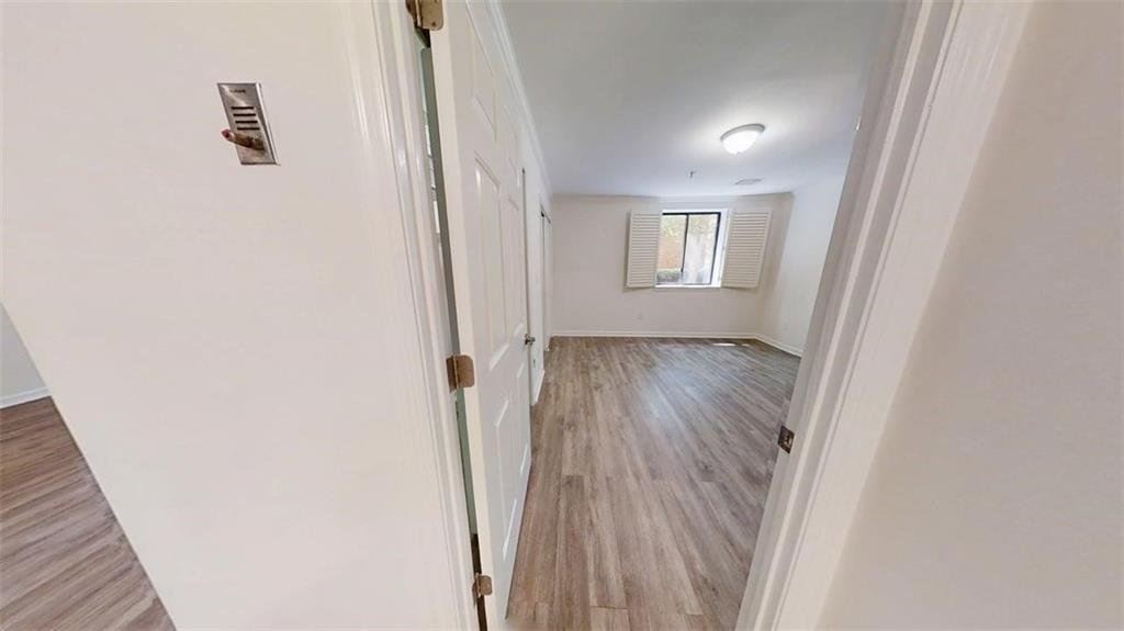 300 Johnson Ferry Road, Unit A112 Atlanta, GA 30328 - Photo 17 of 42 a view of hallway with wooden floor