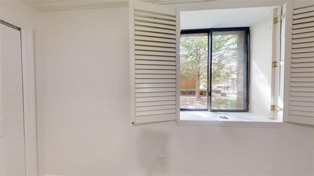 300 Johnson Ferry Road, Unit A112 Atlanta, GA 30328 - Photo 20 of 42 a view of a window in an empty room