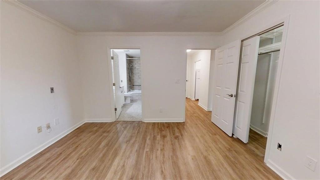 300 Johnson Ferry Road, Unit A112 Atlanta, GA 30328 - Photo 21 of 42 a view of empty room with wooden floor