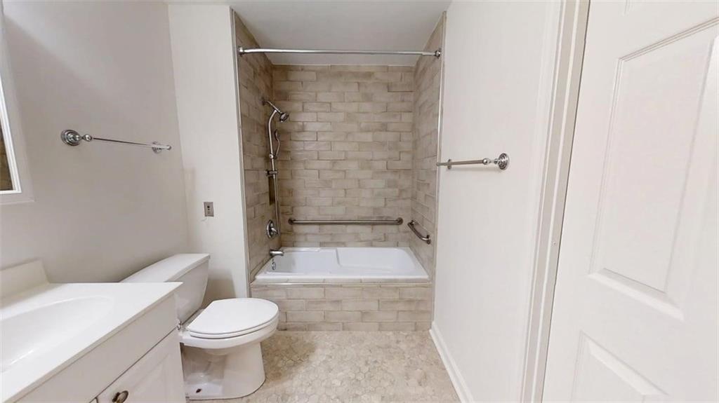 300 Johnson Ferry Road, Unit A112 Atlanta, GA 30328 - Photo 23 of 42 a bathroom with a toilet a sink and shower