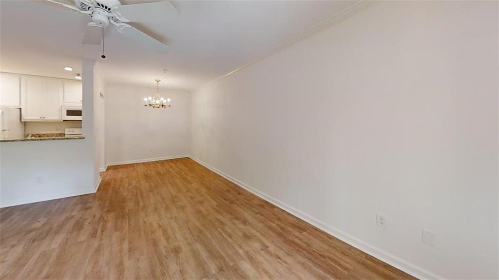 300 Johnson Ferry Road, Unit A112 Atlanta, GA 30328 - Photo 32 of 42 wooden floor in an empty room with a window