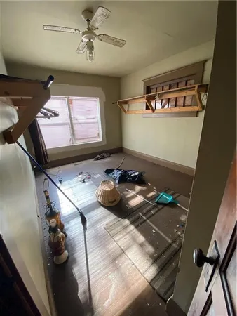 a bedroom with bed and a window