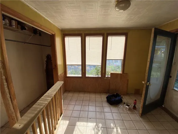 a view of an empty room with windows