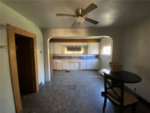a view of a livingroom with furniture and a window