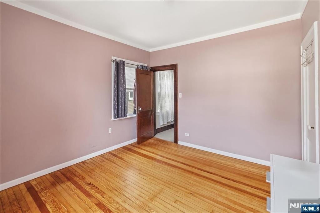 119 Overpeck Avenue Ridgefield Park, NJ 07660 - Photo 23 of 44 a view of an empty room with wooden floor