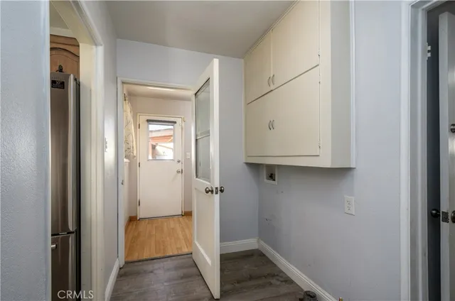 a view of a backyard with a tree