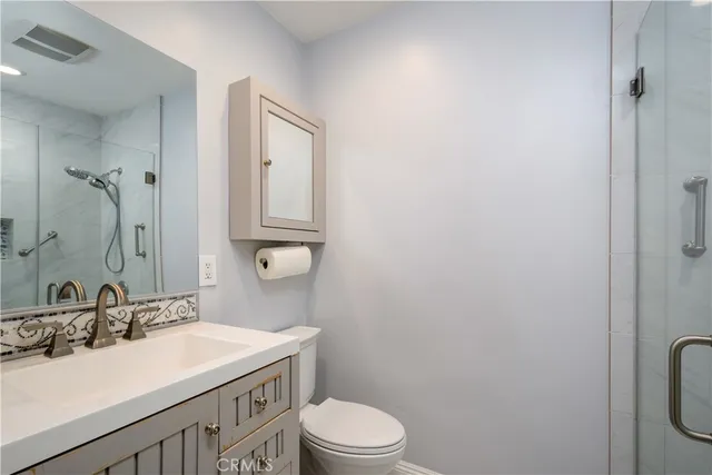 a bathroom with a sink toilet and vanity