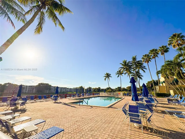 a view of swimming pool with chairs