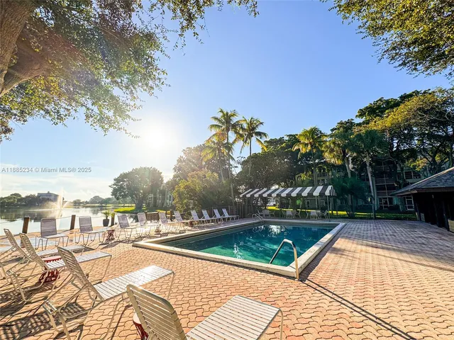 a view of swimming pool with chairs