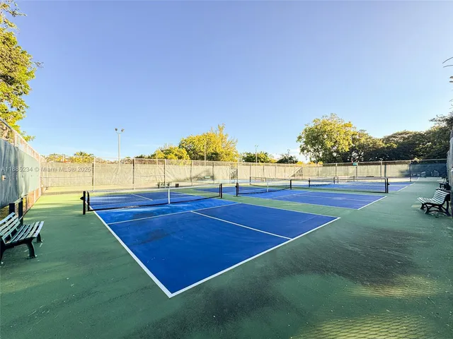 a view of an outdoor space and tennis court
