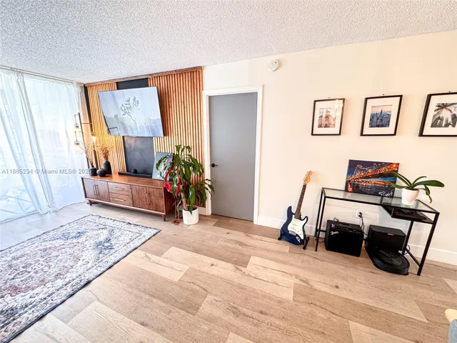 a bedroom with furniture and a rug