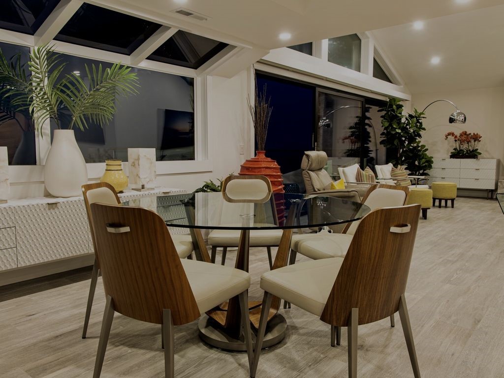 16 North Stonington Road Laguna Beach, CA 92651 - Photo 21 of 33 a dining room with furniture wooden floor and a potted plant