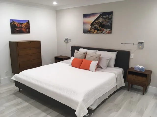 a kitchen with kitchen island granite countertop a sink a stove and cabinets