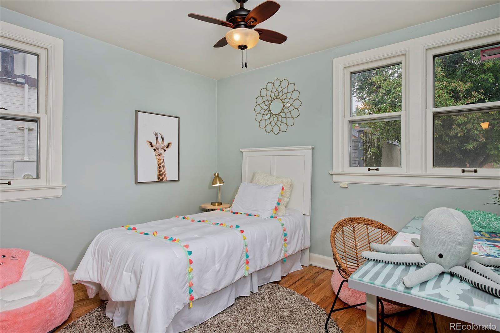 1674 Cherry Street Denver, CO 80220 - Photo 13 of 31 a bedroom with a bed and window