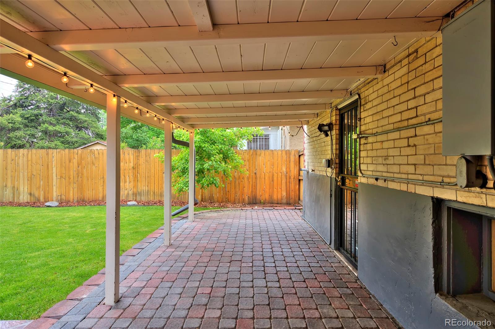 1674 Cherry Street Denver, CO 80220 - Photo 24 of 31 a view of a back yard from a patio