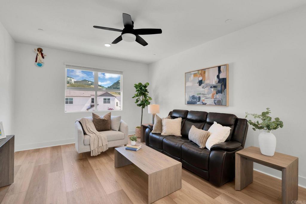 35374 Orchard Trail Fallbrook, CA 92028 - Photo 12 of 33 a living room with furniture and a wooden floor