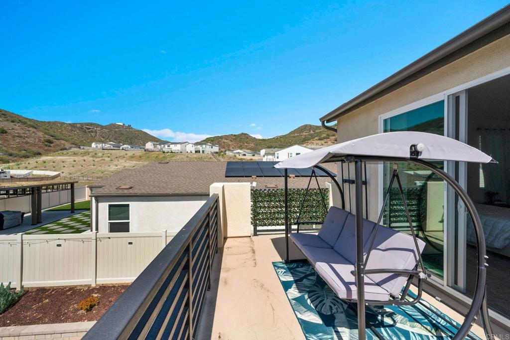 35374 Orchard Trail Fallbrook, CA 92028 - Photo 19 of 33 a view of a balcony with furniture