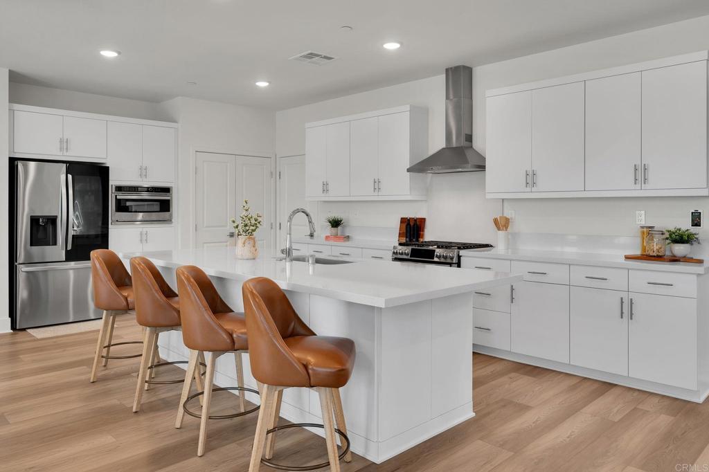 35374 Orchard Trail Fallbrook, CA 92028 - Photo 2 of 33 a kitchen with stainless steel appliances kitchen island granite countertop a sink and cabinets