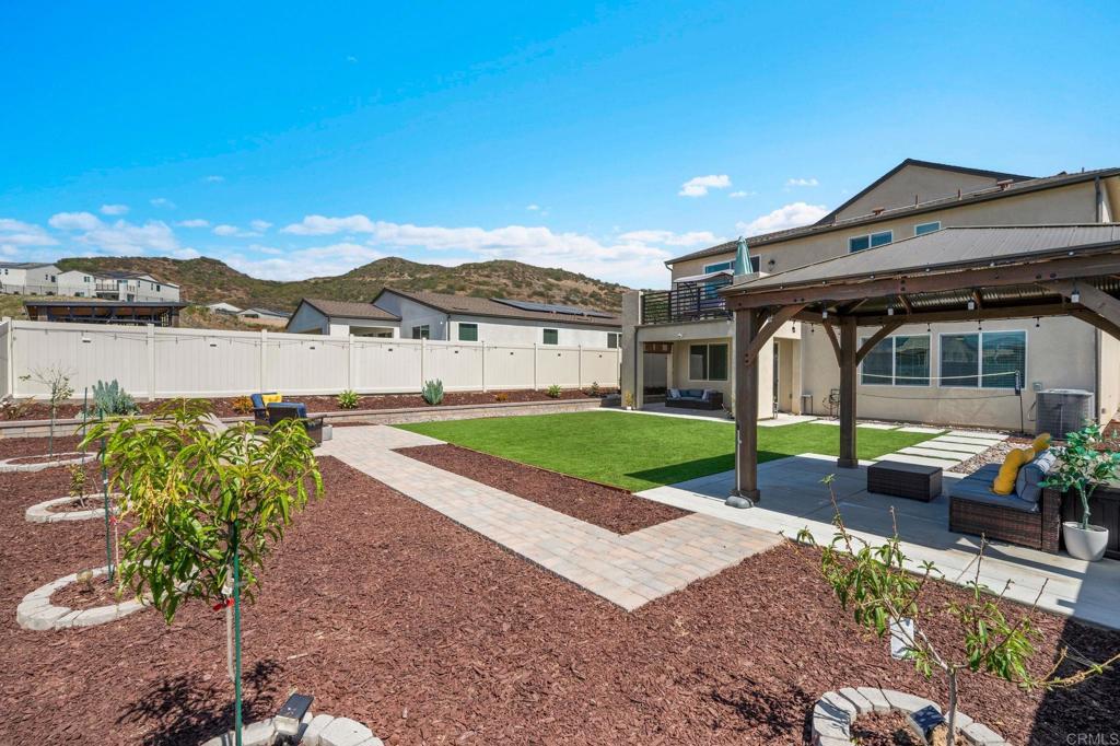 35374 Orchard Trail Fallbrook, CA 92028 - Photo 21 of 33 a view of house with garden and tall trees