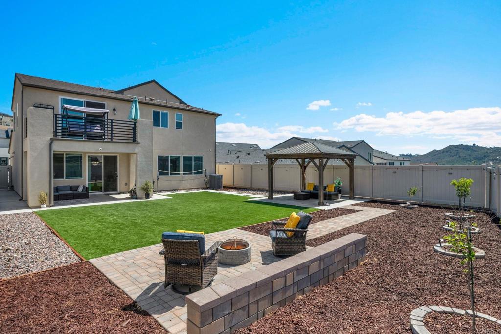 35374 Orchard Trail Fallbrook, CA 92028 - Photo 3 of 33 a front view of a house with a garden and yard