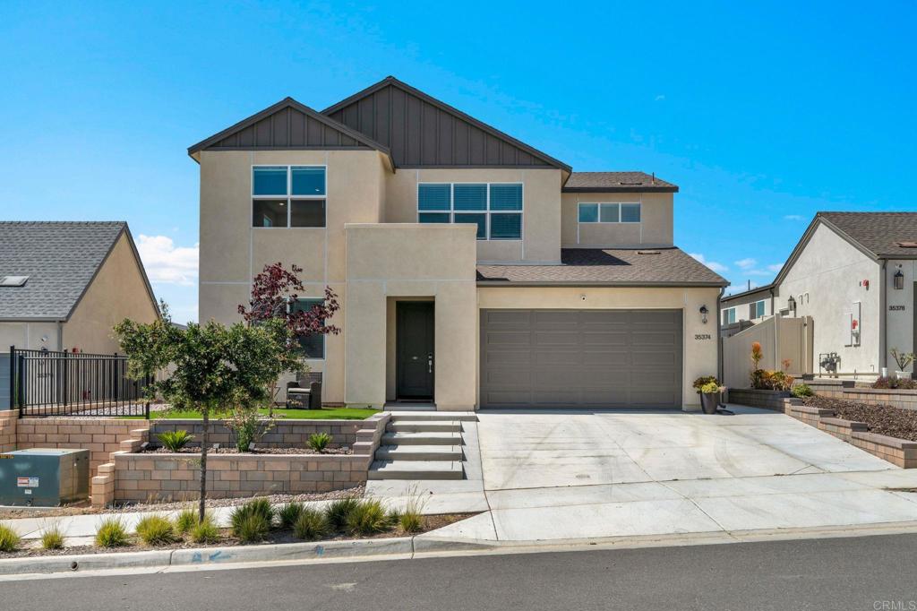35374 Orchard Trail Fallbrook, CA 92028 - Photo 5 of 33 a front view of a house with a garage