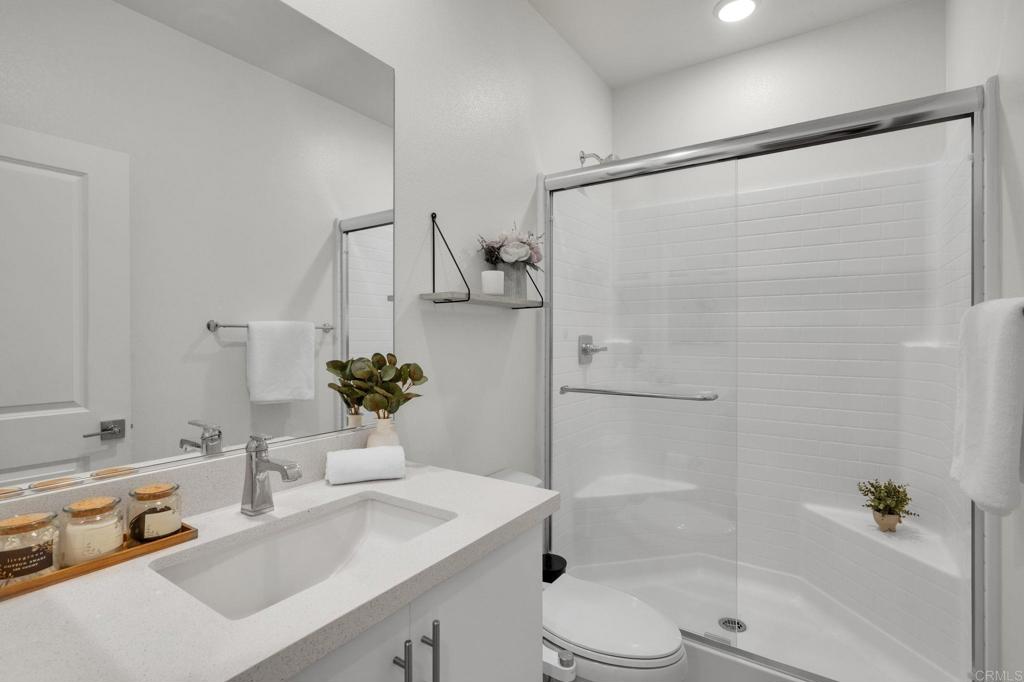 35374 Orchard Trail Fallbrook, CA 92028 - Photo 9 of 33 a bathroom with a sink toilet and shower