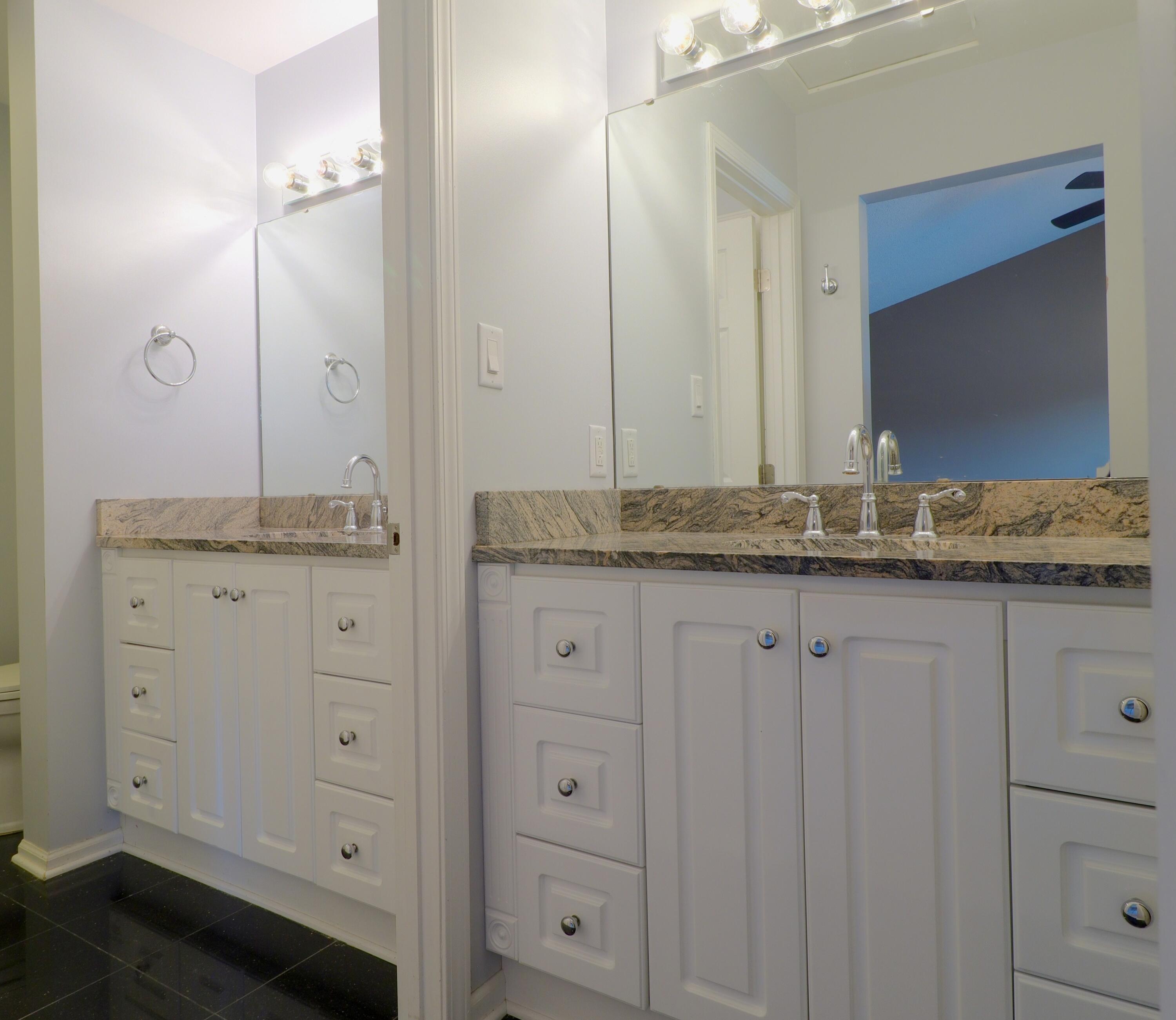 767 Kenmare Parkway Crown Point, IN 46307 - Photo 12 of 27 a bathroom with a granite countertop sink and a mirror