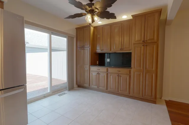 a view of a kitchen with a sink and cabinet