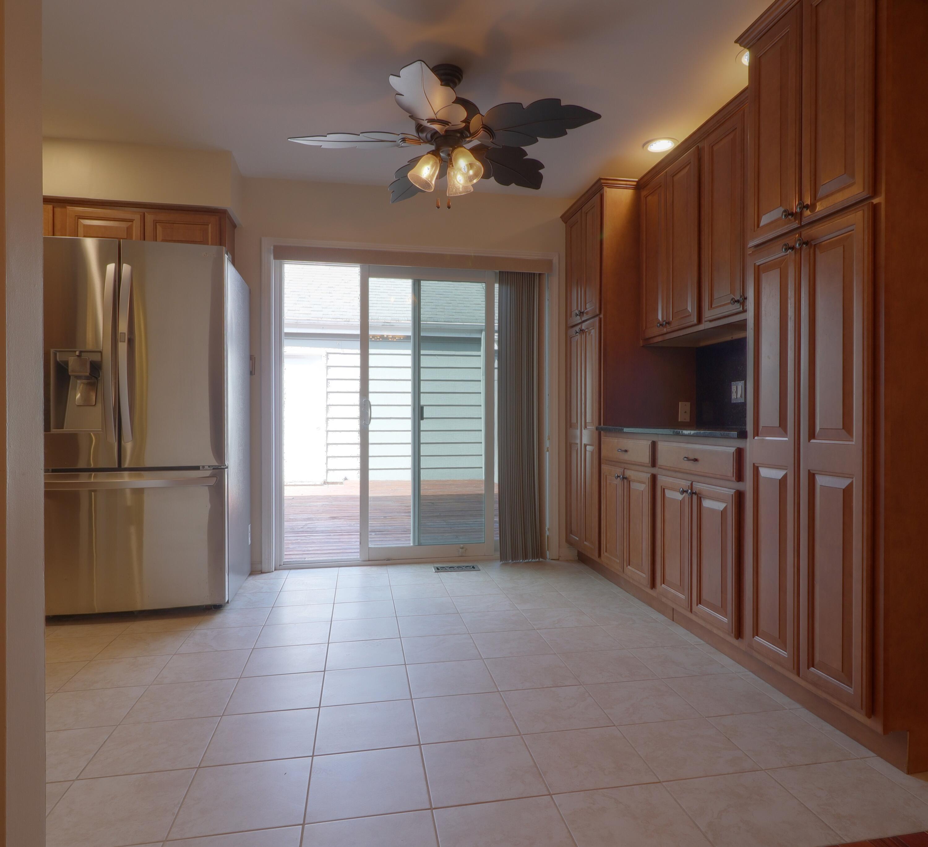 767 Kenmare Parkway Crown Point, IN 46307 - Photo 8 of 27 a kitchen with stainless steel appliances granite countertop a refrigerator a sink a stove and a cabinets