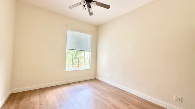a bathroom with a sink a toilet a mirror and shower