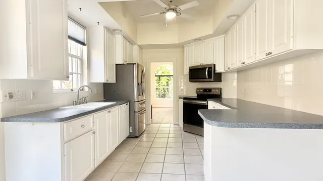 an empty room with windows and entrance