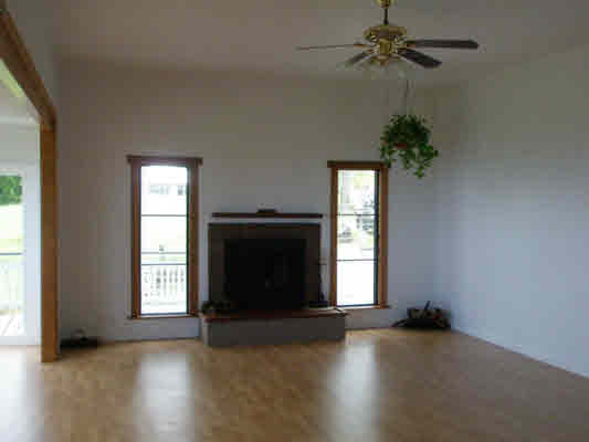 1939 Kaiwiki Road Hilo, HI 96720 - Photo 12 of 16 an empty room with windows and fireplace