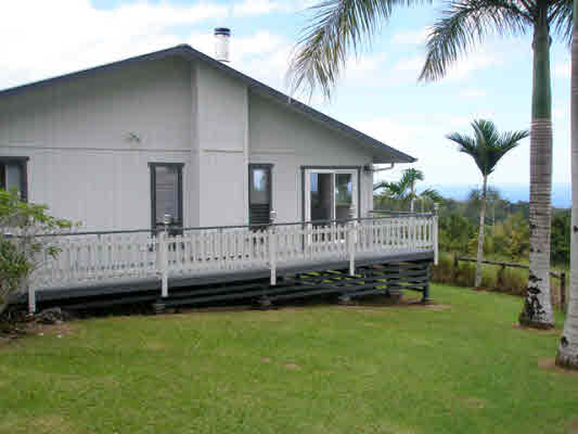 1939 Kaiwiki Road Hilo, HI 96720 - Photo 2 of 16 a view of a house with a backyard and a wooden deck