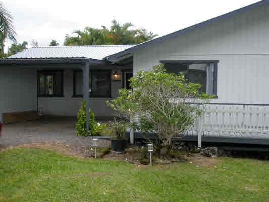 1939 Kaiwiki Road Hilo, HI 96720 - Photo 3 of 16 a view of a house with a yard and sitting area
