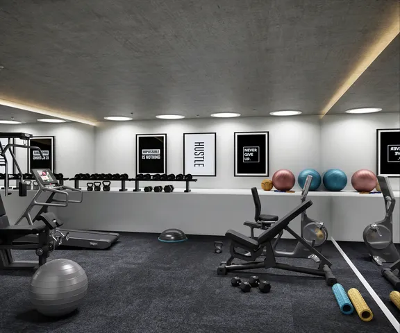 a room with gym equipment and a flat screen tv