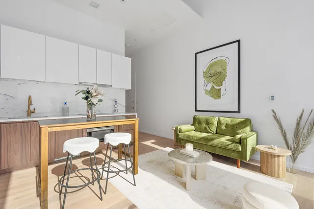 a bathroom with a double vanity sink a mirror and a shower