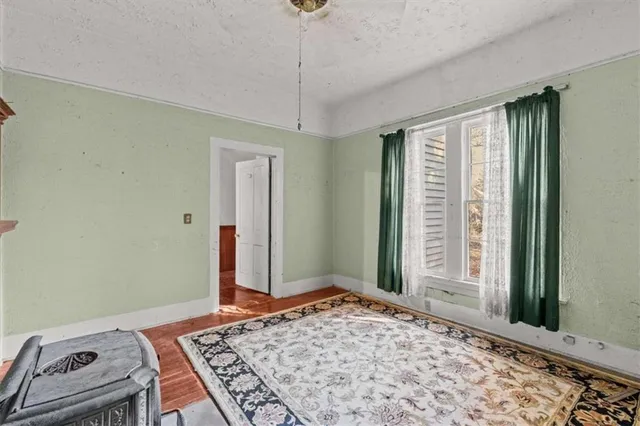 a white toilet sitting next to a shower