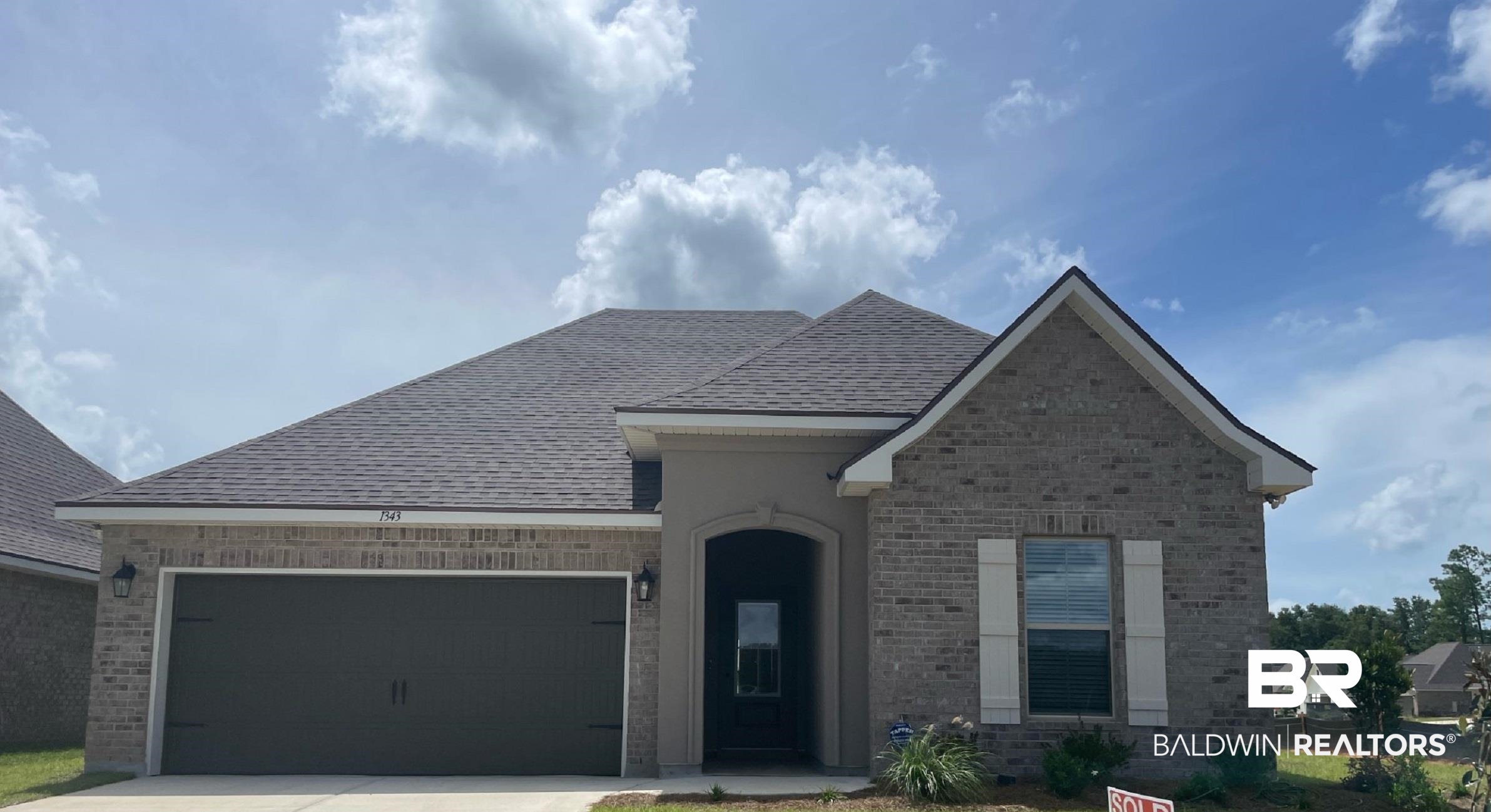 View of front of property featuring a garage
