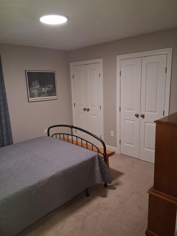 2348 East Ruritan Road Roanoke, VA 24012 - Photo 27 of 31 a bed sitting in a bedroom next to a window