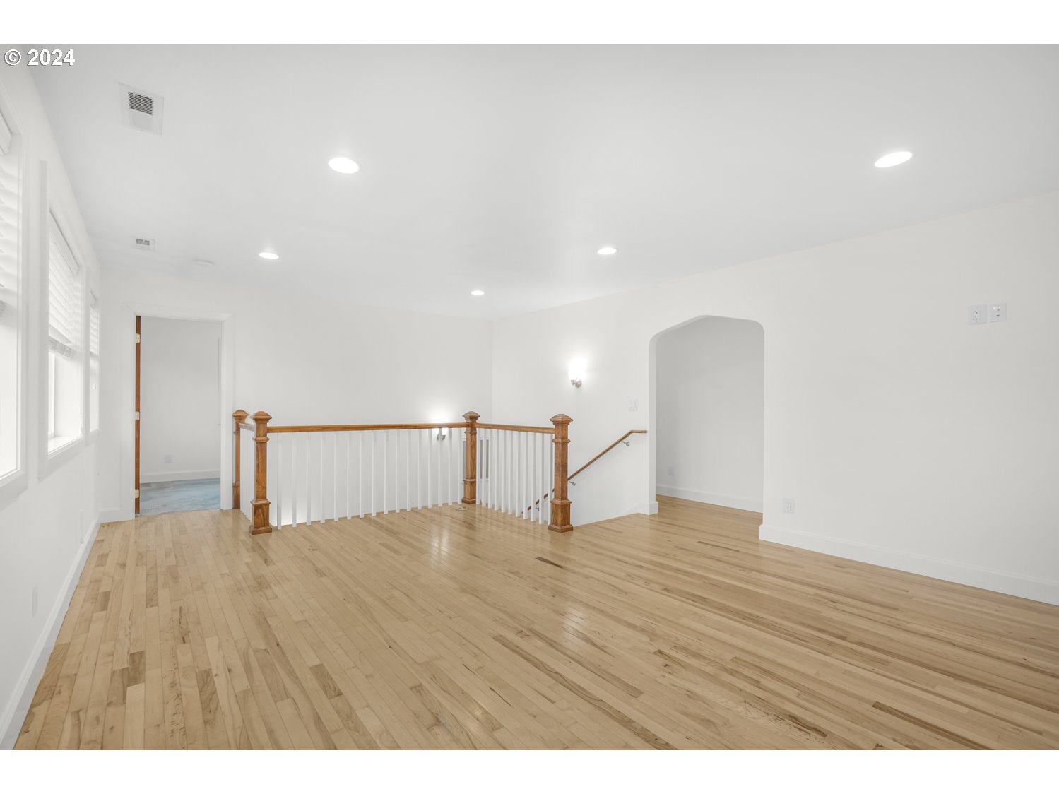 311 Washington Street Lyle, WA 98635 - Photo 17 of 29 a view of an empty room with wooden floor