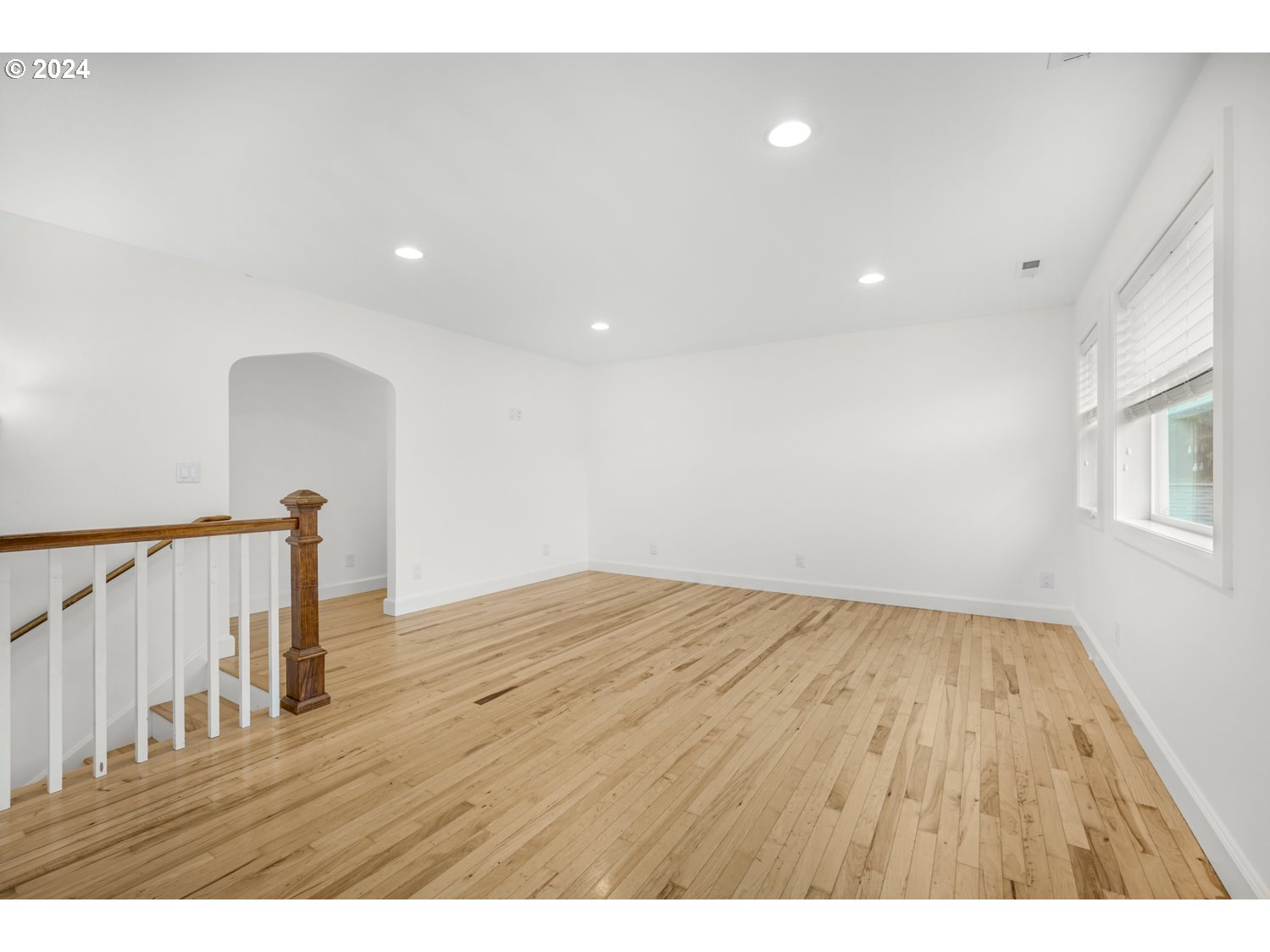 311 Washington Street Lyle, WA 98635 - Photo 18 of 29 a view of an empty room with wooden floor and a window