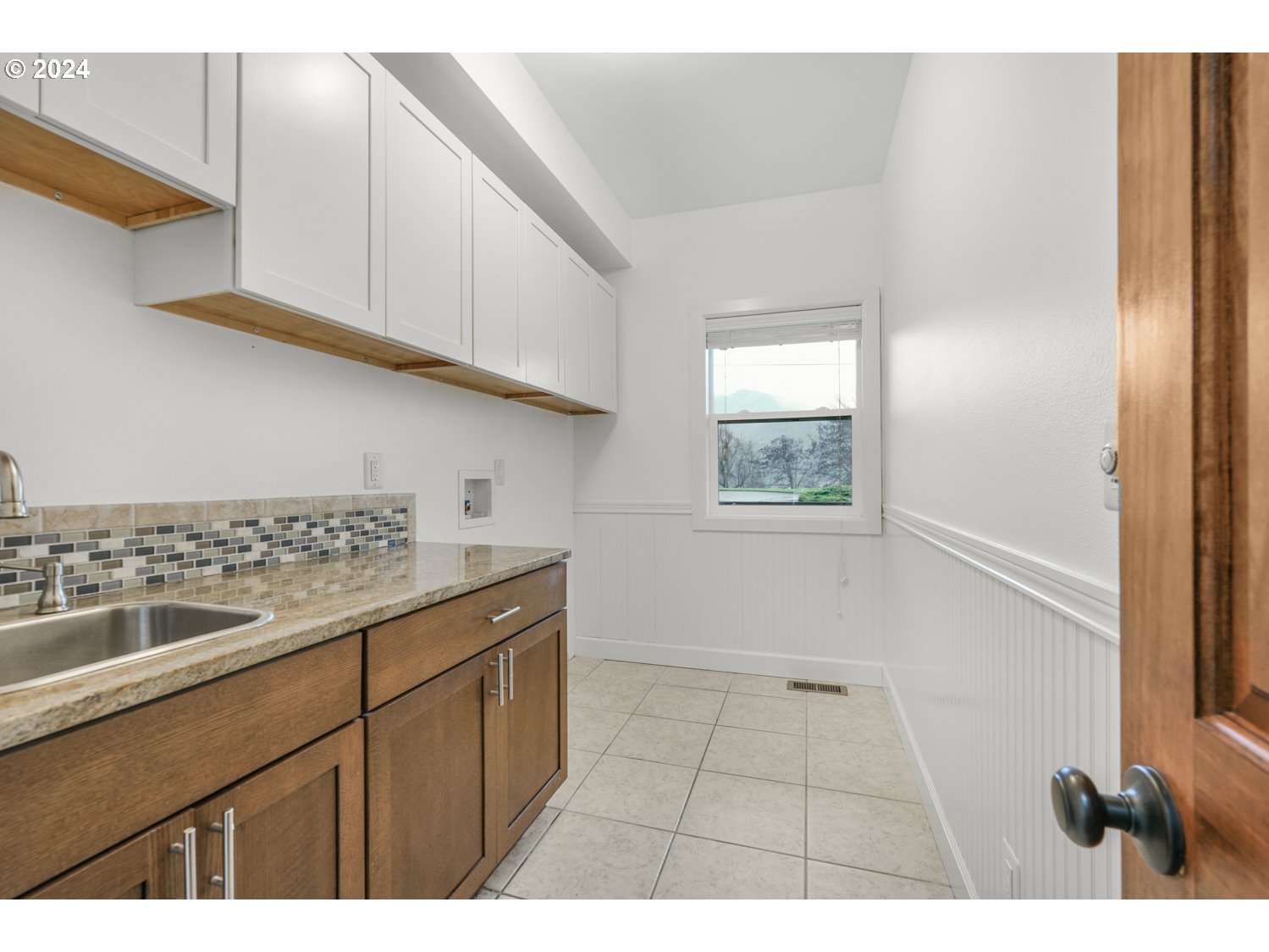 311 Washington Street Lyle, WA 98635 - Photo 25 of 29 a kitchen with a sink and cabinets
