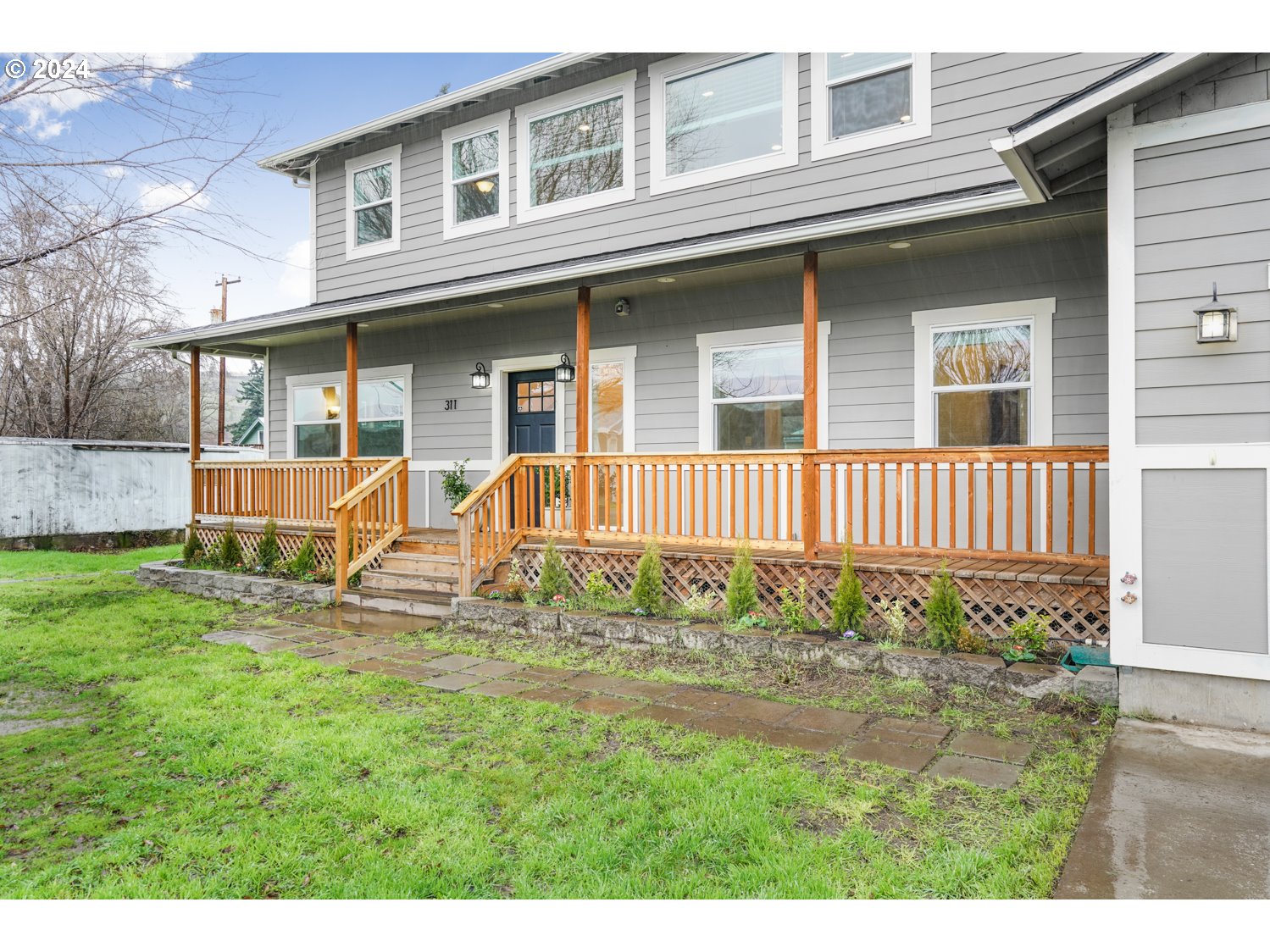 311 Washington Street Lyle, WA 98635 - Photo 26 of 29 a view of a house with backyard and sitting area